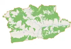 Mapa konturowa gminy Tokarnia, w centrum znajduje się punkt z opisem „Parafia Matki Bożej Śnieżnej”