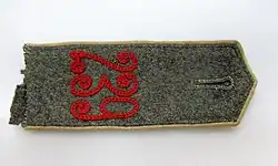 Niemiecki naramiennik z okresu I wojny światowej z wyhaftowanym numerem pułku