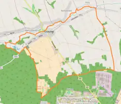 Mapa konturowa Urzędowa, blisko centrum u góry znajduje się punkt z opisem „Parafia Św. Mikołaja”