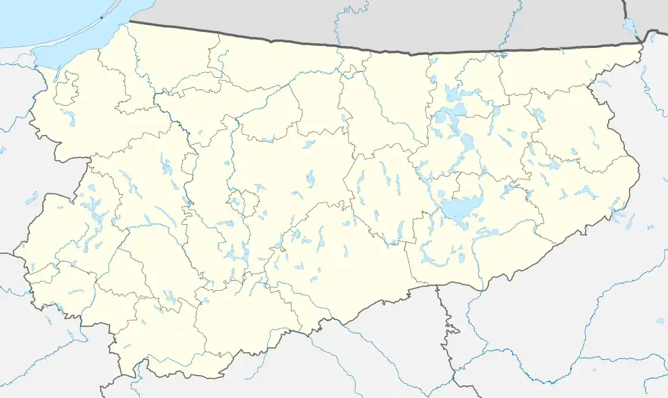 Mapa konturowa województwa warmińsko-mazurskiego, u góry po lewej znajduje się punkt z opisem „Młynary”