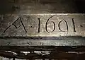 Rok 1691 na odrzwiach w piwnicy